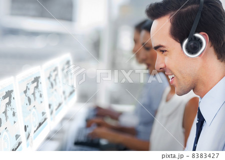 Call center staff at work on futuristic interfaces showing maps Call center staff at work on futuristic interfaces showing maps 8383427