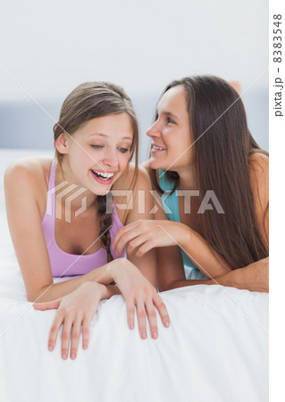 Friends lying in bed Friends lying in bed 8383548