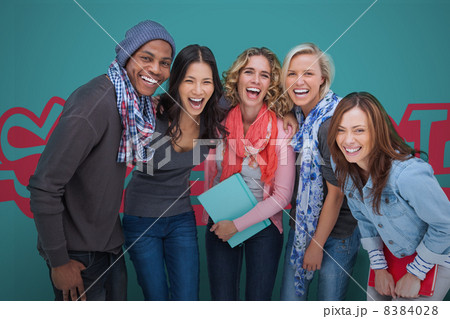 Group of smiling friends posing together 8384028