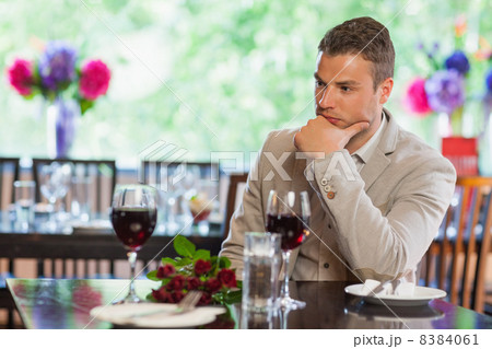 Handsome man waiting for his girlfriend at restaurant Handsome man waiting for his girlfriend at restaurant 8384061