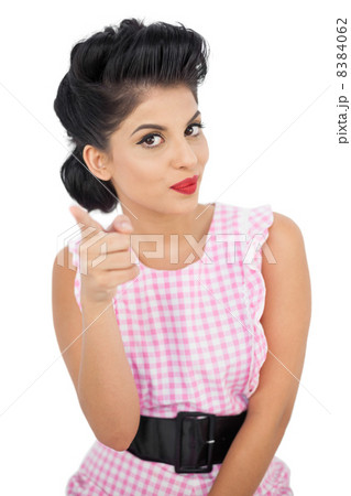 Pleased black hair model pointing a figer at camera Pleased black hair model pointing a figer at camera 8384062