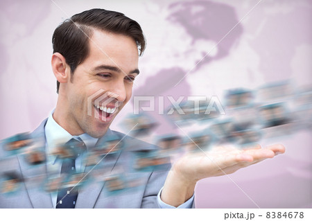 Cheerful businessman admiring a picture whirl Cheerful businessman admiring a picture whirl 8384678