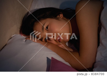 Young asian woman suffering from insomnia 8384700