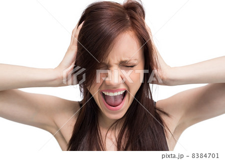 Close up on exasperated brunette screaming Close up on exasperated brunette screaming 8384701