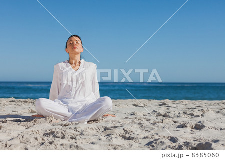 Peaceful woman sitting and relaxing Peaceful woman sitting and relaxing 8385060