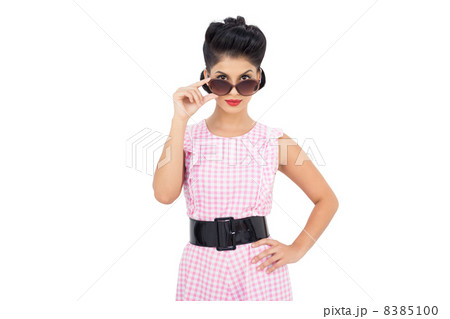 Pretty black hair model looking over her sunglasses 8385100