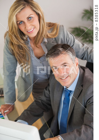 Business team in an office looking at camera 8385318