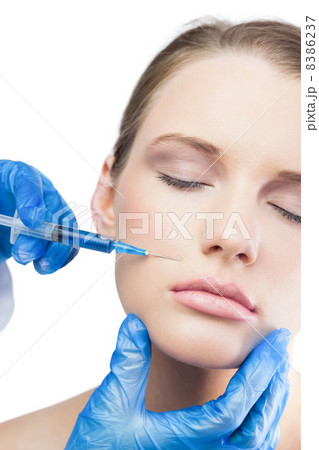 Relaxed gorgeous model having botox injection above the lips Relaxed gorgeous model having botox injection above the lips 8386237