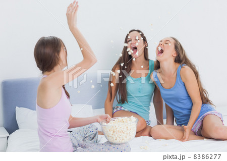 Friends messing around at slumber party 8386277