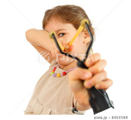 Girl with slingshot aim to camera isolated on white background 8403589