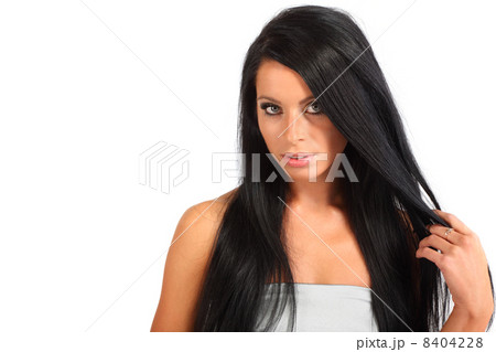 beautiful brunette woman with flowing hair looks mysteriously is beautiful brunette woman with flowing hair looks mysteriously is 8404228