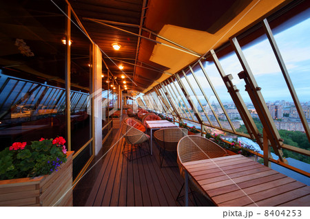 Row of spherical wicker chairs and tables at terrace in empty re Row of spherical wicker chairs and tables at terrace in empty re 8404253