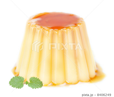 Delicious pudding with caramel and mint leaves. On a white backg Delicious pudding with caramel and mint leaves. On a white backg 8406249