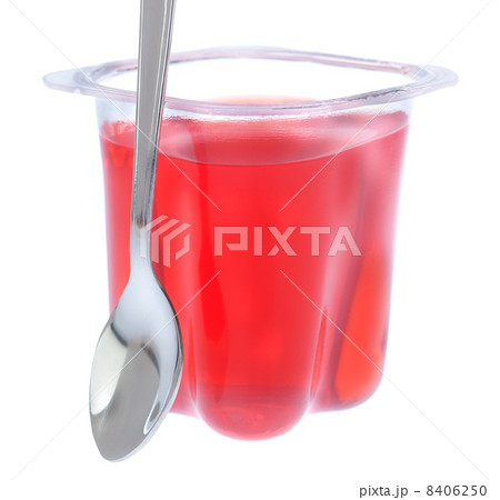 Red gelatin in a plastic bag with a spoon. On a white background Red gelatin in a plastic bag with a spoon. On a white background 8406250