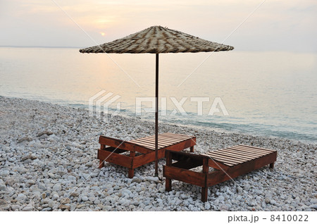 two chairs and umbrella on the beach two chairs and umbrella on the beach 8410022