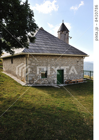Old small mosque in mountains 8410786