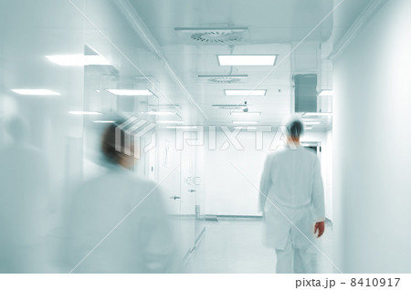 Working people with white uniforms walking in modern factory environment 8410917
