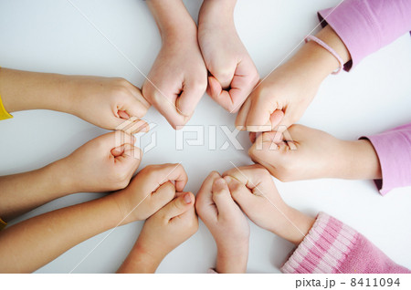 Picture of hands to stay together over the table to show solidarity 8411094