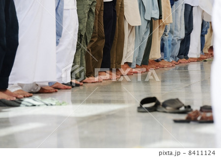 Muslims praying together at Holy mosque Muslims praying together at Holy mosque 8411124