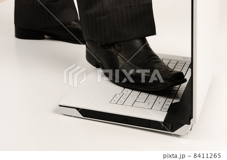 Business foot walk over laptop with white background Business foot walk over laptop with white background 8411265