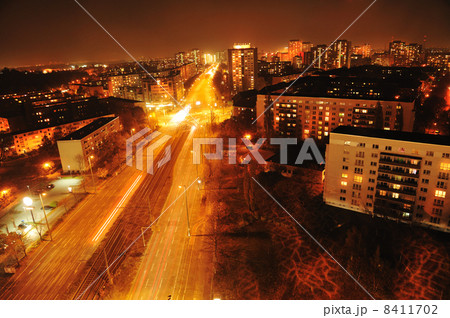 Modern Urban City at Night with Freeway Traffic 8411702