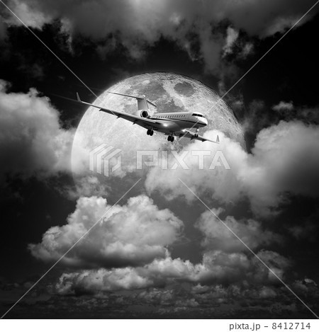 Small private jet aircraft in a night sky 8412714