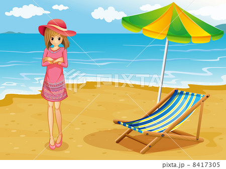 A lady wearing a pink dress at the beach 8417305