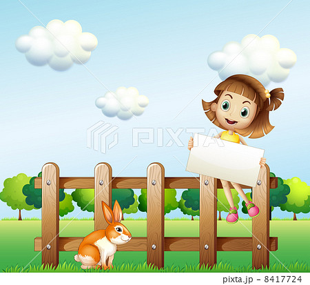 A girl sitting on a wooden fence holding an empty signage A girl sitting on a wooden fence holding an empty signage 8417724