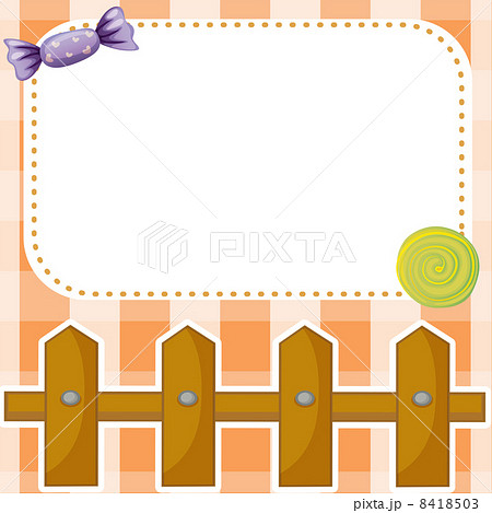 An empty paper note with candies and a wooden fence 8418503
