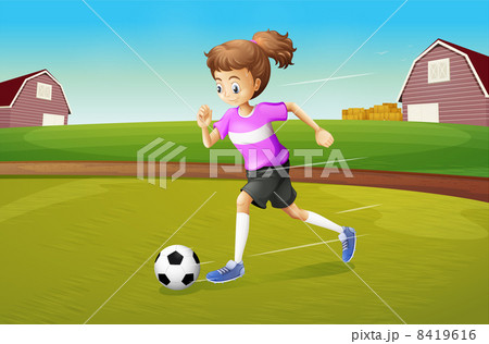A girl playing football at the farm A girl playing football at the farm 8419616