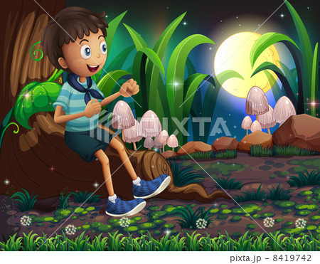 A young boy sitting above the roots of a giant tree 8419742