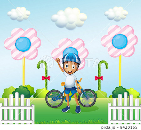 A happy boy at the candyland with his bike A happy boy at the candyland with his bike 8420165