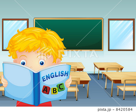 A kid reading inside the classroom A kid reading inside the classroom 8420584