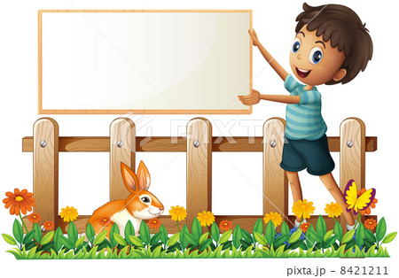 A boy holding a framed board in the garden 8421211