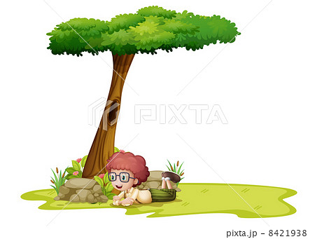 A boy playing under the tree 8421938