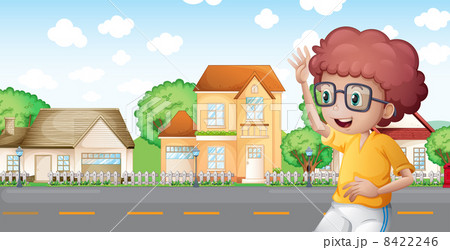 A boy jogging in front of the neighborhood A boy jogging in front of the neighborhood 8422246