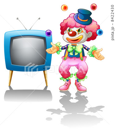 A clown standing near the T.V. A clown standing near the T.V. 8422430