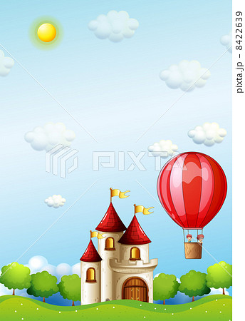 Two boys riding in a hot air balloon near the castle 8422639