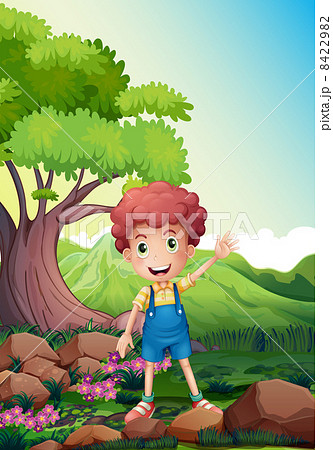 A happy boy waving near the rocks A happy boy waving near the rocks 8422982