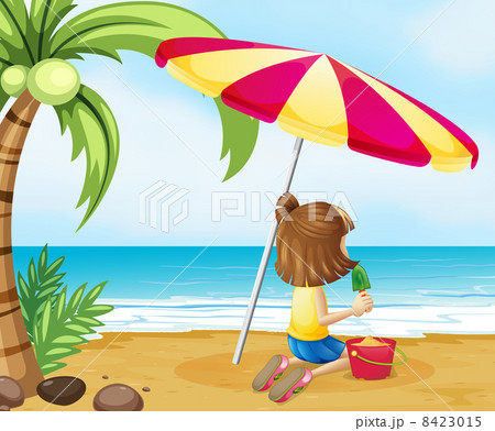 A young girl playing with the castle at the beach A young girl playing with the castle at the beach 8423015