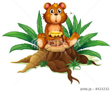 A bear with honey above a trunk A bear with honey above a trunk 8423232