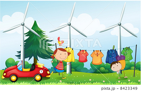 Kids playing at the hill with hanging clothes 8423349