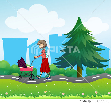 A girl with a baby stroller along the road 8423360