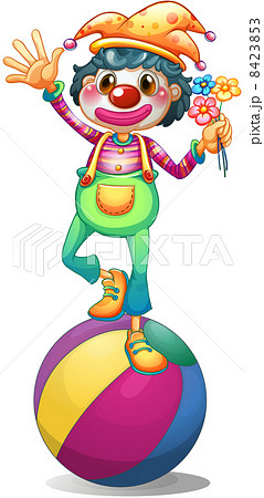 A clown balancing above a ball 8423853