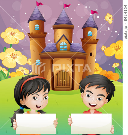 Two kids with empty signages standing in front of the castle 8424154