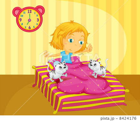 A girl waking up at the bed with two kittens A girl waking up at the bed with two kittens 8424176