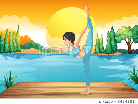 A girl performing yoga along the river in a sunset scenery 8424381