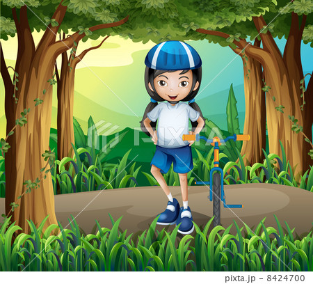 A girl standing beside her bike in the middle of the jungle 8424700