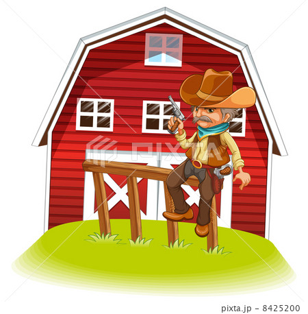 A cowboy holding a gun sitting on a wood in front of the barnhou 8425200