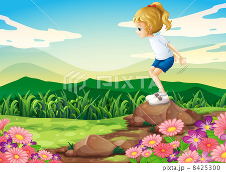 A young girl playing at the hilltop with rocks and a garden A young girl playing at the hilltop with rocks and a garden 8425300